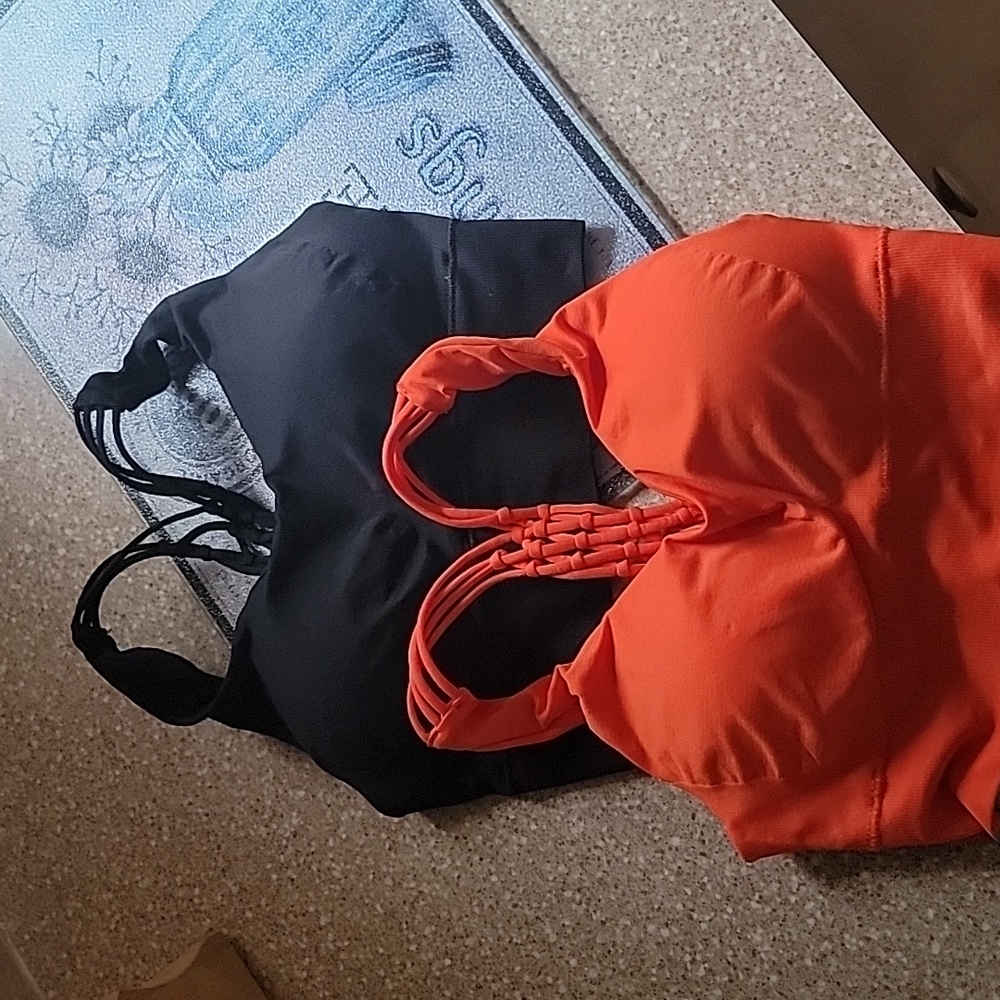 Two Pro-fit razor back sports bras